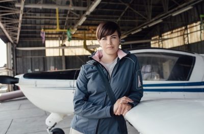 Female Pilot In Hangar