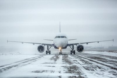 Taking Off On Snowy Runway
